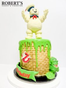 Ghostbusters cake | Ghostbusters cake I made for my best mate's birthday. Slimer and the Staypuft marshmallow man were made with homemade modelling chocolate and Rice Krispy treats, Kellogs LCMs. | https://robertscakesandcooking.com/ghostbusters-cake/