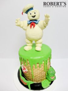 Ghostbusters cake | Ghostbusters cake I made for my best mate's birthday. Slimer and the Staypuft marshmallow man were made with homemade modelling chocolate and Rice Krispy treats, Kellogs LCMs. | https://robertscakesandcooking.com/ghostbusters-cake/